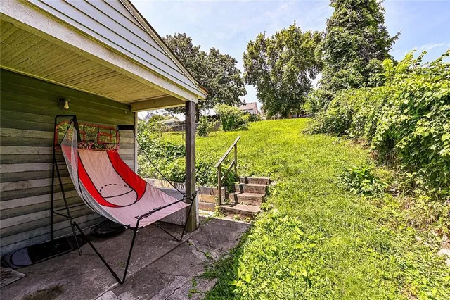 a backyard of a house with outdoor seating