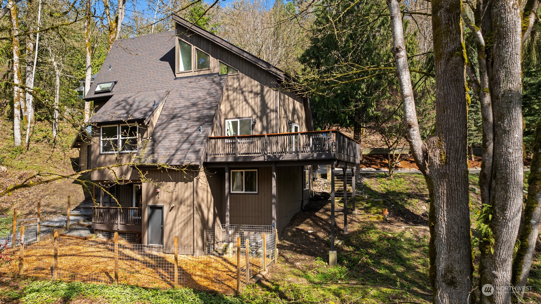 front view of a house with a tree