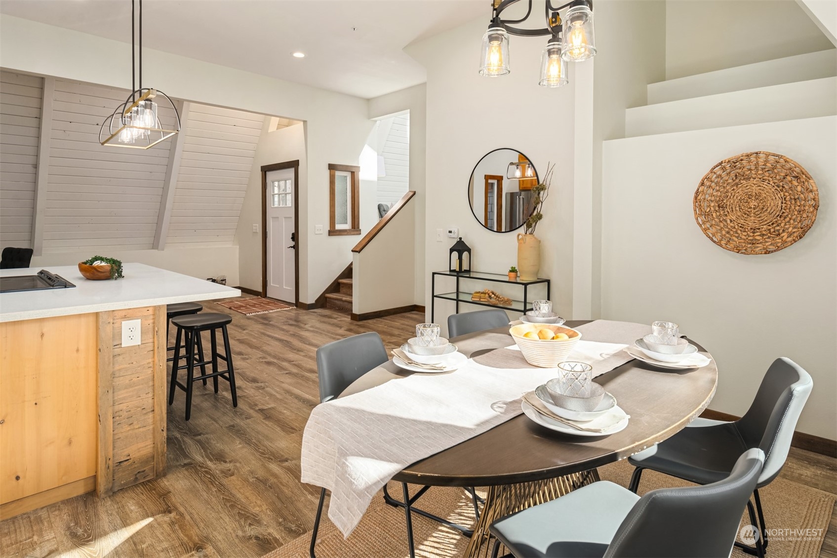 17548 Southeast 110th Street Renton, WA 98059 - Photo 12 of 37 a view of a dining room with furniture and wooden floor