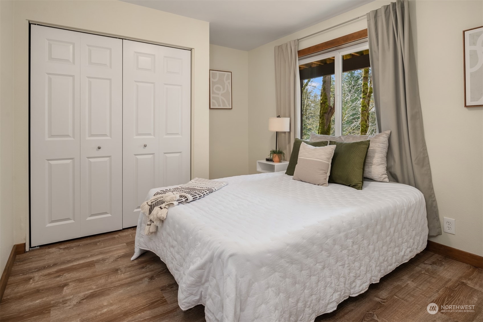 17548 Southeast 110th Street Renton, WA 98059 - Photo 27 of 37 a bedroom with a bed and a window