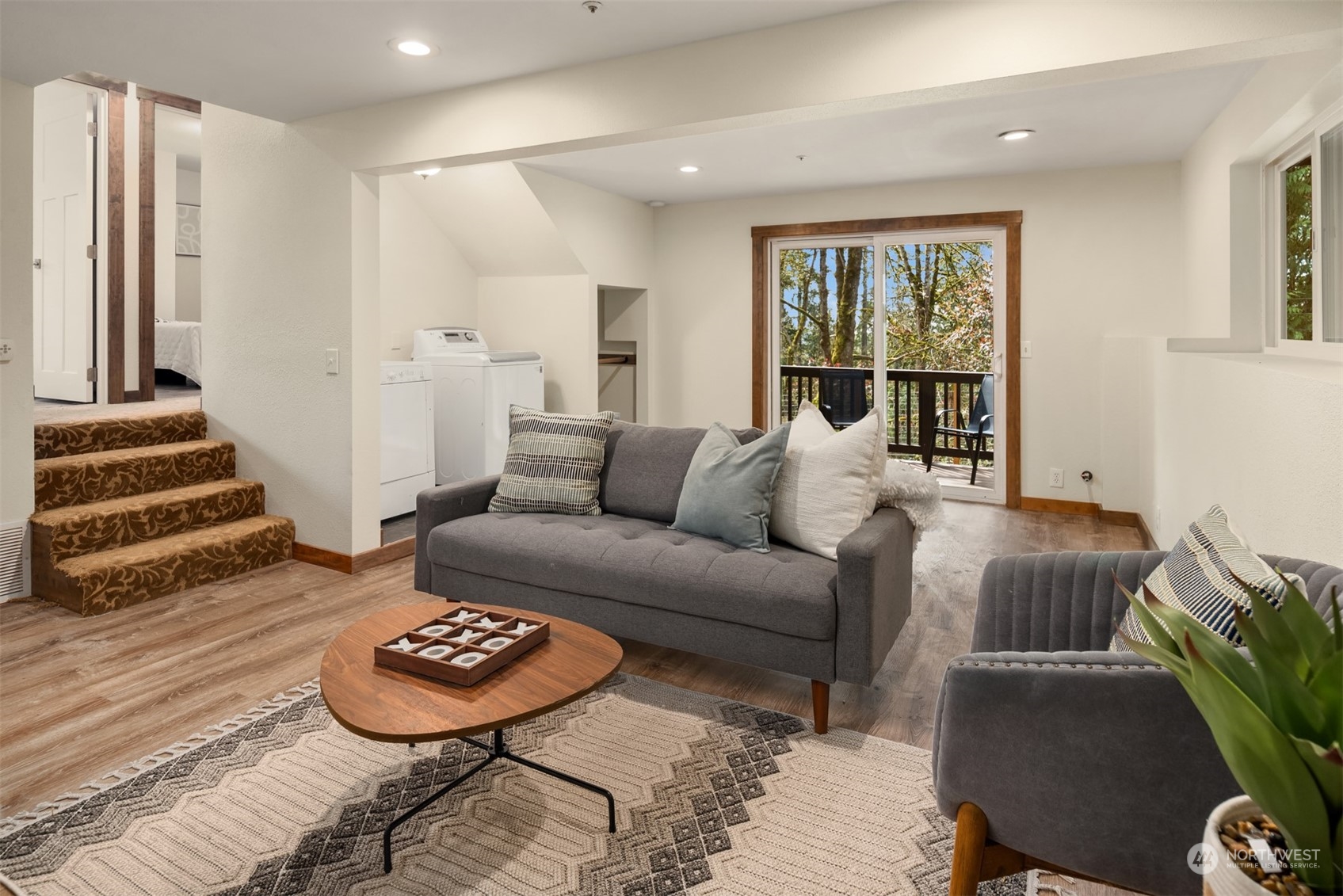 17548 Southeast 110th Street Renton, WA 98059 - Photo 31 of 37 a living room with furniture and a rug