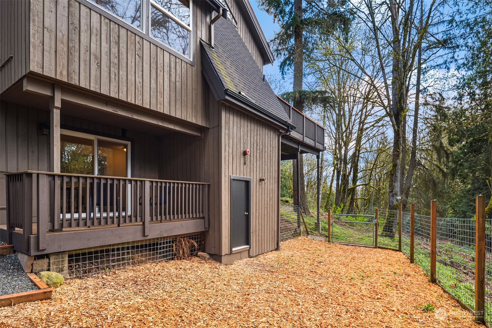 17548 Southeast 110th Street Renton, WA 98059 - Photo 34 of 37 a backyard of a house with a bench and trees
