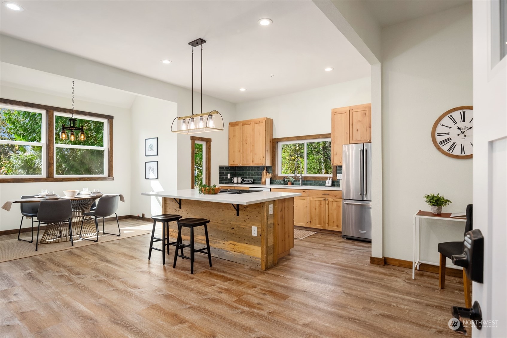 17548 Southeast 110th Street Renton, WA 98059 - Photo 5 of 37 a large kitchen with granite countertop a large island in the center