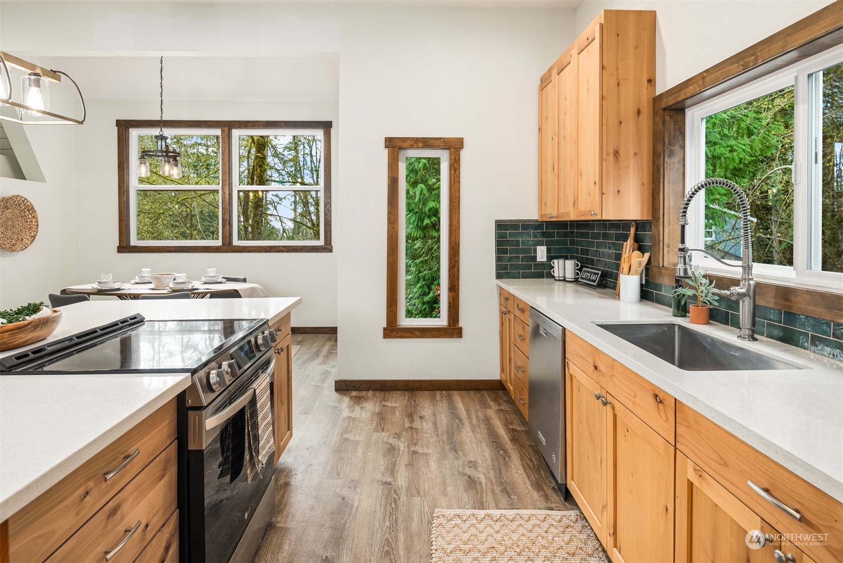 17548 Southeast 110th Street Renton, WA 98059 - Photo 9 of 37 a kitchen with a sink stove top oven and a window