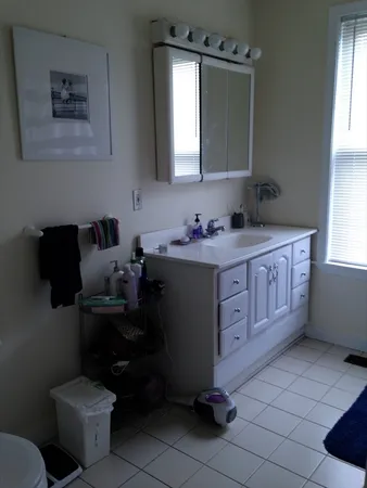 a kitchen with a sink cabinets and appliances