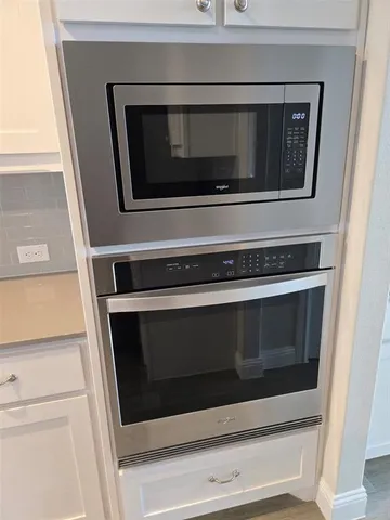 a stove top oven sitting inside of a microwave