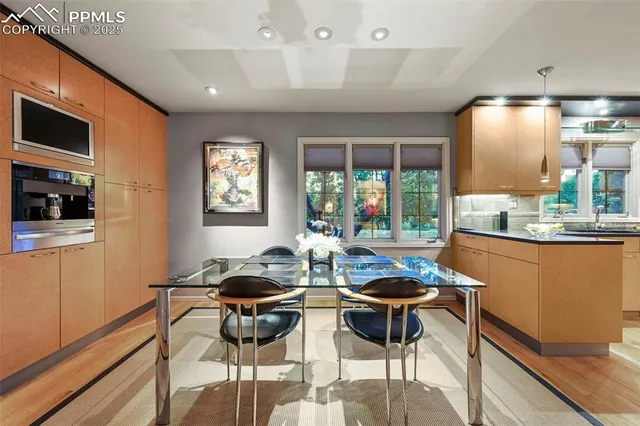 a outdoor dining space with furniture and a window