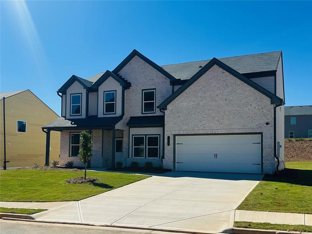 325 Rodeo Drive Auburn, GA 30011 - Photo 2 of 39 a front view of a house with a yard
