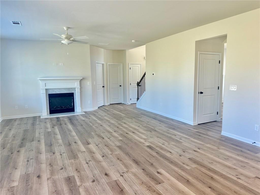 325 Rodeo Drive Auburn, GA 30011 - Photo 21 of 39 a view of an empty room and wooden floor