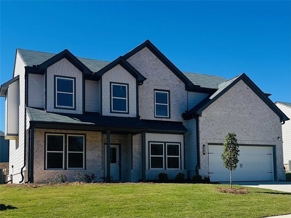 325 Rodeo Drive Auburn, GA 30011 - Photo 3 of 39 a front view of a house with a yard