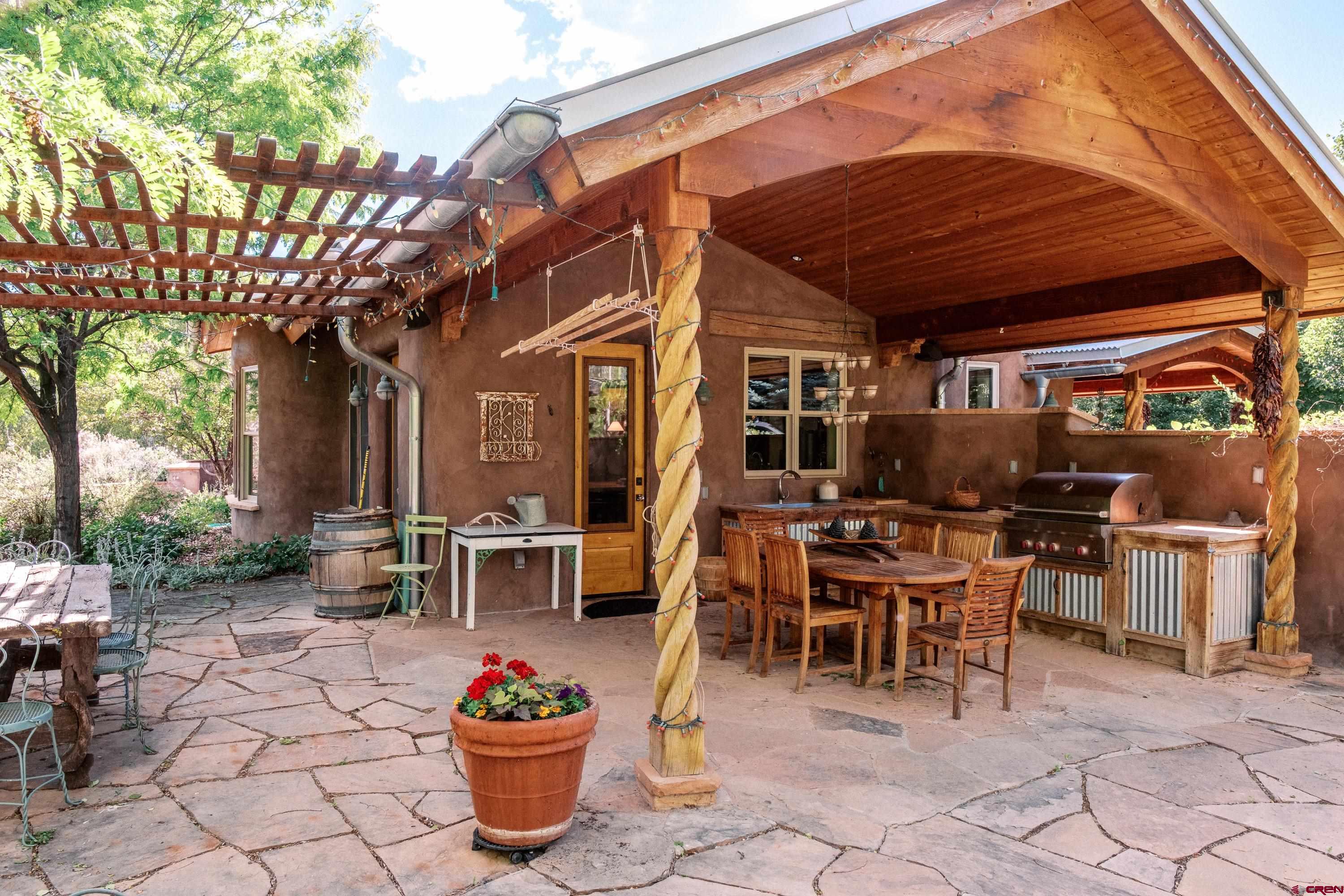 41723 O Road Paonia, CO 81428 - Photo 6 of 44 a view of a patio with a dining table and chairs