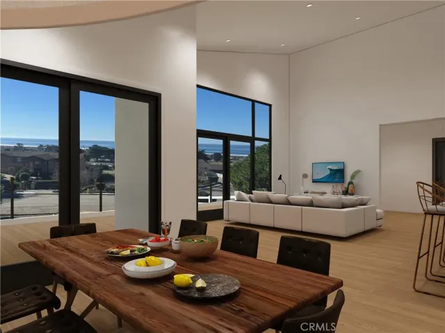 a dining room with furniture and a floor to ceiling window