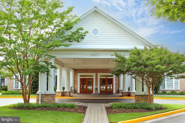 a living room with furniture fireplace and a window
