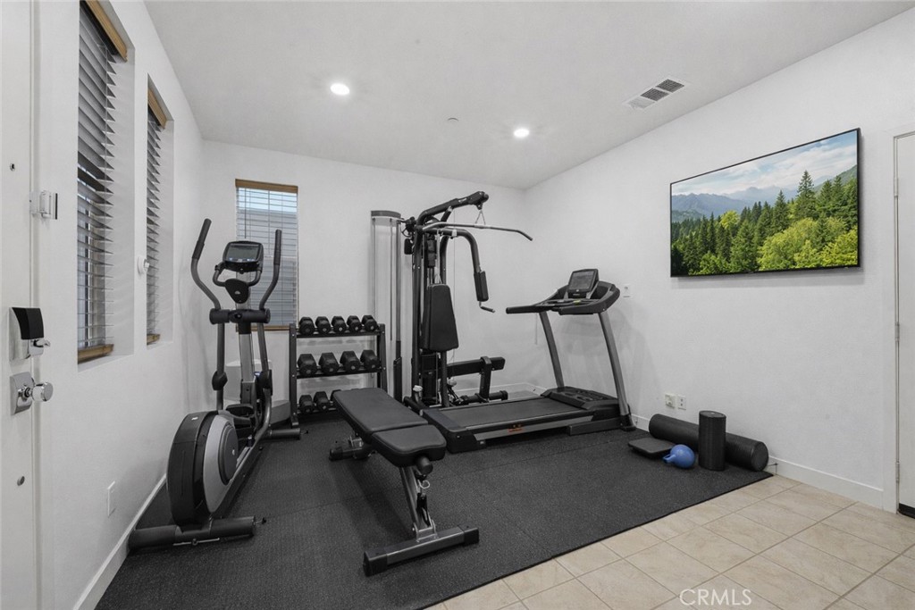 1040 North Anaheim, Unit 1 Anaheim, CA 92801 - Photo 4 of 45 Entry level flex room is ideal for multipurpose like a gym (Virtually Staged)