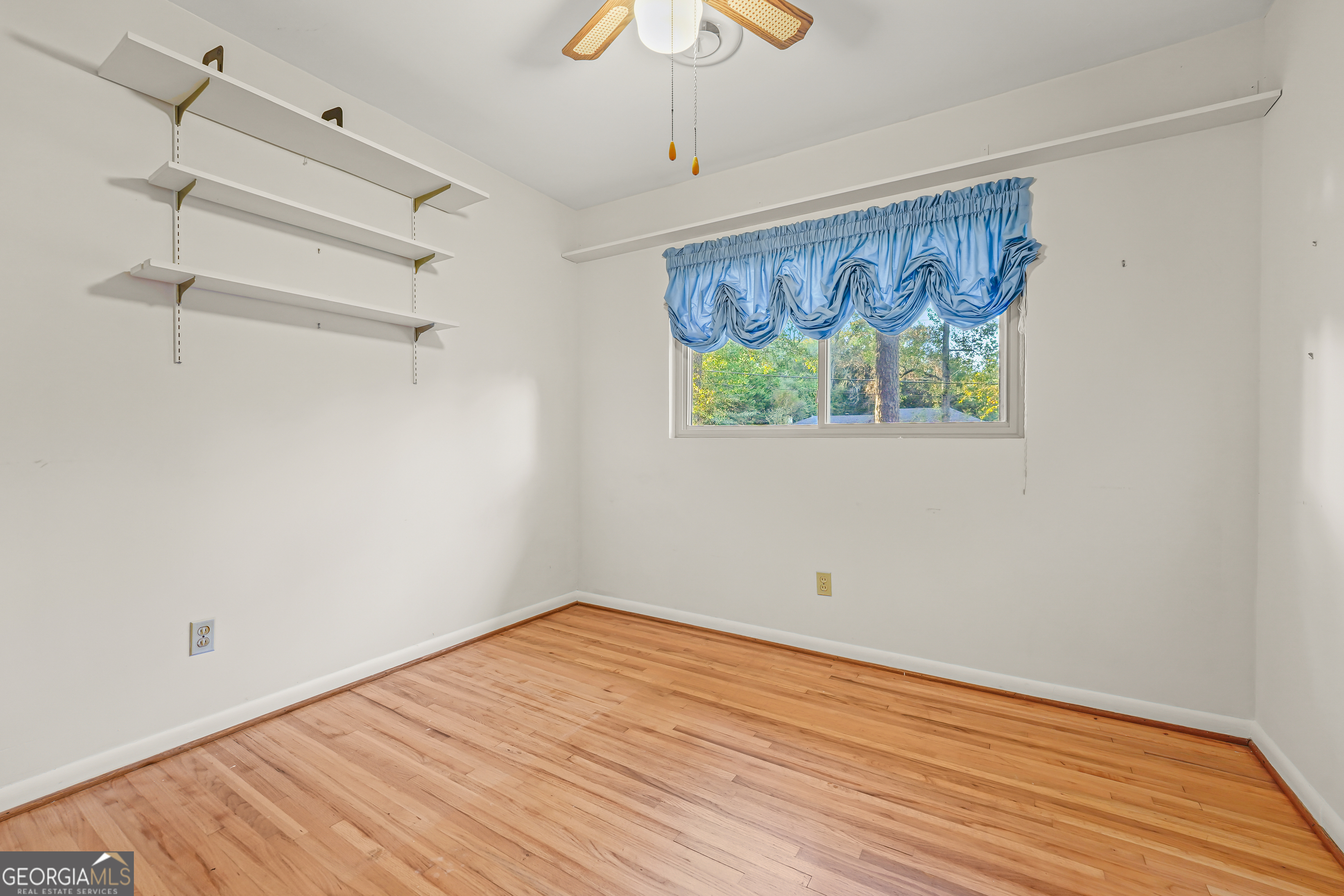 1784 Cedarwood Road Milledgeville, GA 31061 - Photo 21 of 30 a view of empty room with wooden floor and fan
