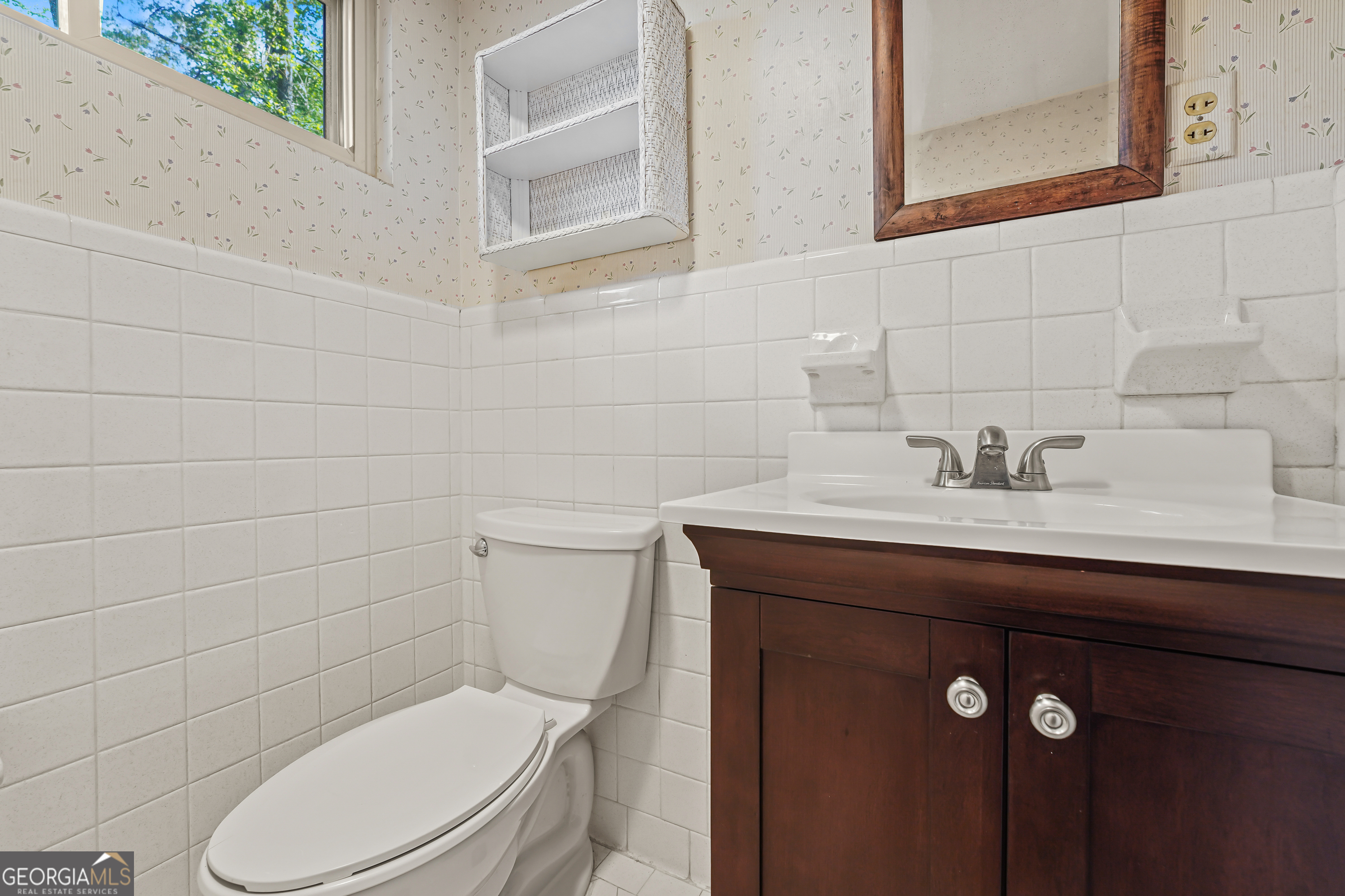 1784 Cedarwood Road Milledgeville, GA 31061 - Photo 22 of 30 a bathroom with a sink a toilet and mirror