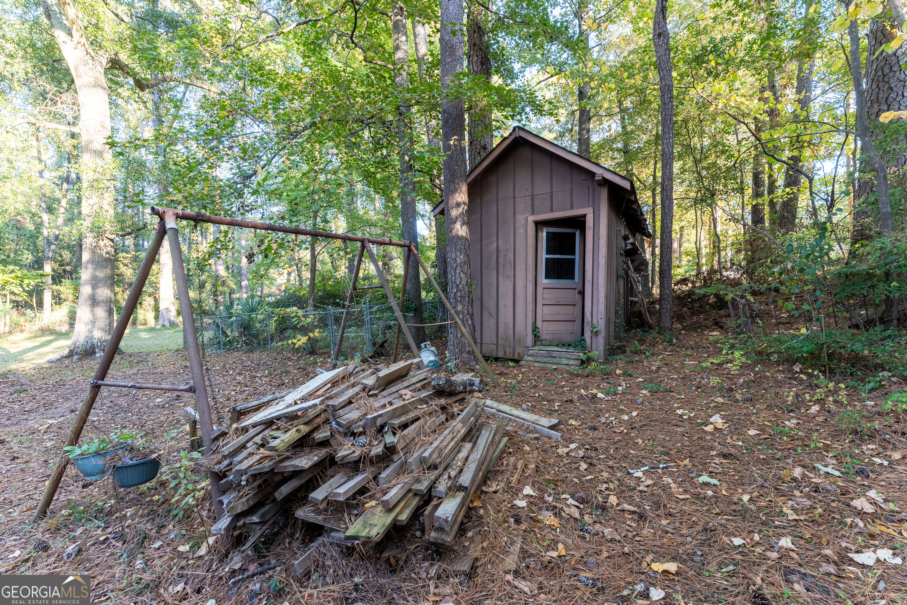 1784 Cedarwood Road Milledgeville, GA 31061 - Photo 30 of 30 a view of a house with backyard and trees