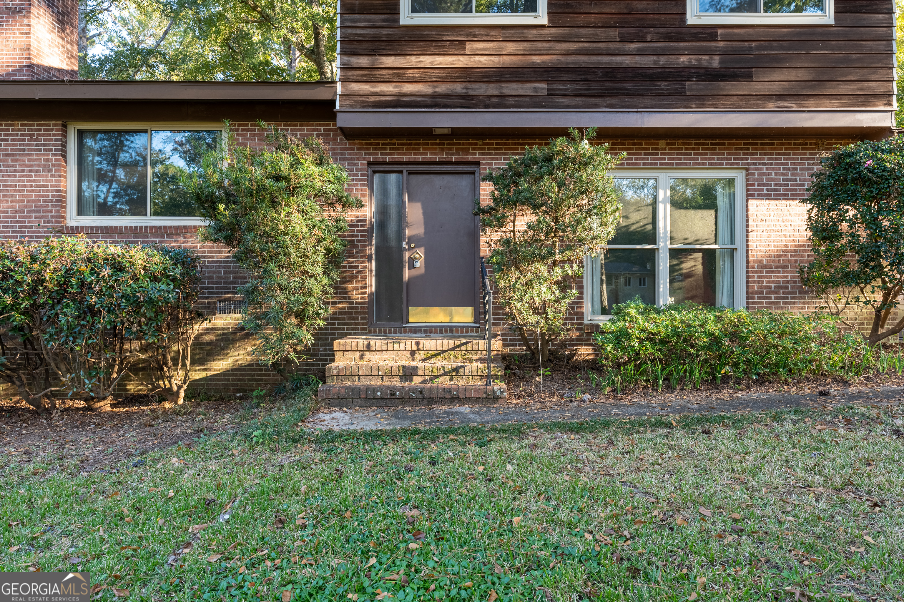 1784 Cedarwood Road Milledgeville, GA 31061 - Photo 4 of 30 a front view of a house with a garden