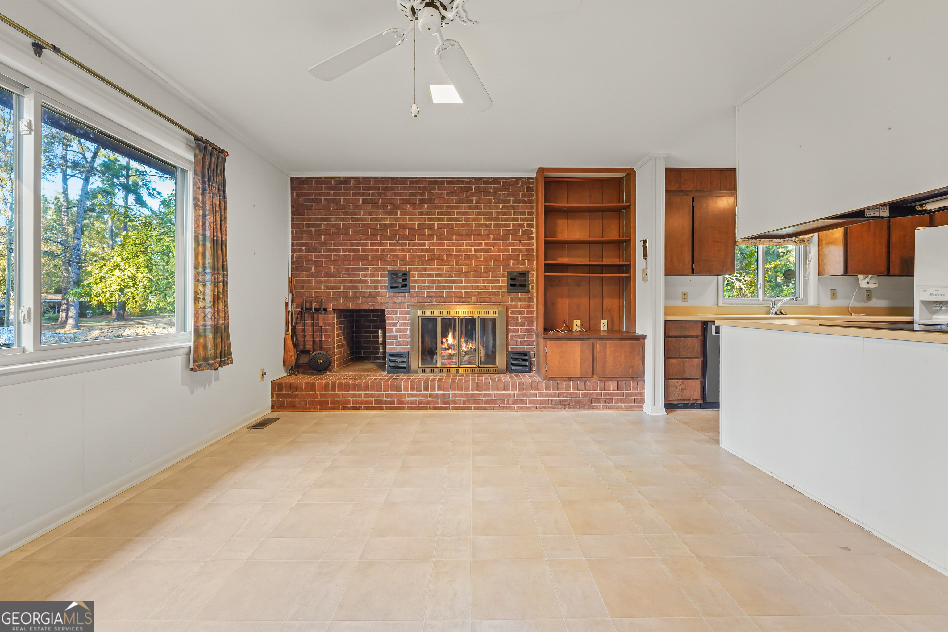 1784 Cedarwood Road Milledgeville, GA 31061 - Photo 6 of 30 a view of a livingroom with furniture window and kitchen view