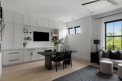 a view of a dining room with furniture and window