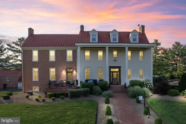 a front view of a building with garden