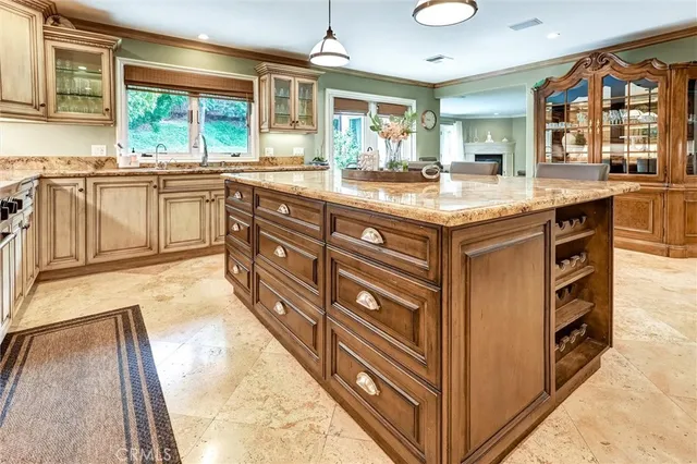 a kitchen with stainless steel appliances granite countertop a stove and a sink