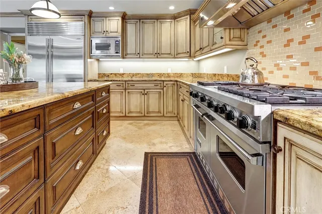 a living room with furniture a fireplace and a table