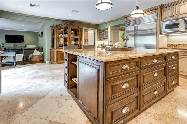 a view of a room with furniture and windows