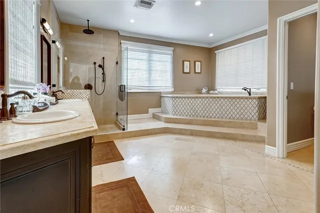 a bathroom with a glass shower door