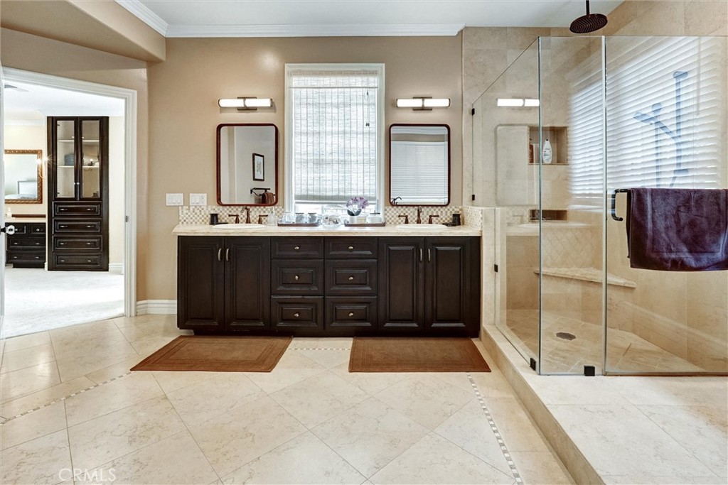 4751 Topeka Drive Tarzana, CA 91356 - Photo 37 of 65 a spacious bathroom with a tub sink and mirror
