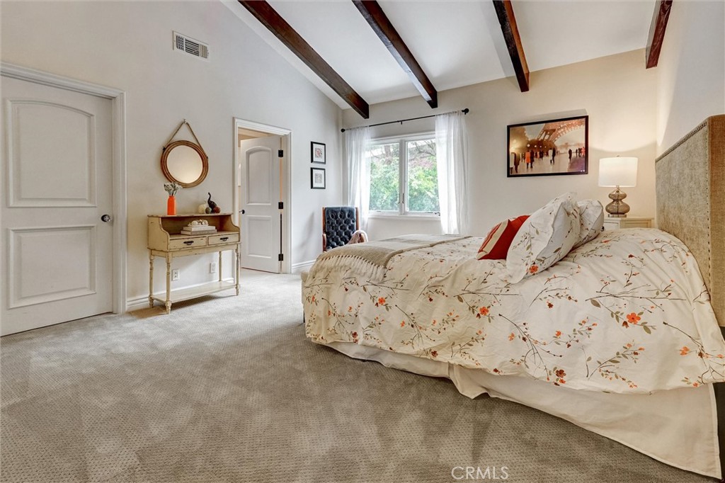 4751 Topeka Drive Tarzana, CA 91356 - Photo 47 of 65 a bedroom with bed and a window