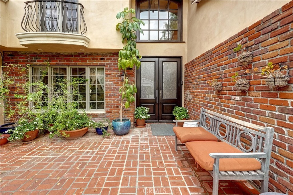 4751 Topeka Drive Tarzana, CA 91356 - Photo 5 of 65 a view of a balcony with chairs and potted plants