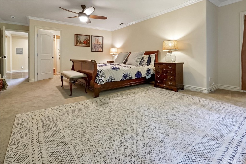 4751 Topeka Drive Tarzana, CA 91356 - Photo 51 of 65 a bedroom with furniture and a lamp