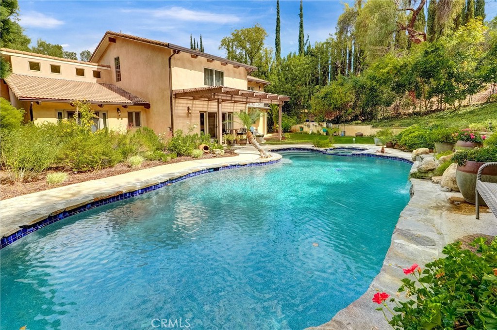 4751 Topeka Drive Tarzana, CA 91356 - Photo 59 of 65 a aerial view of a house with swimming pool garden and patio