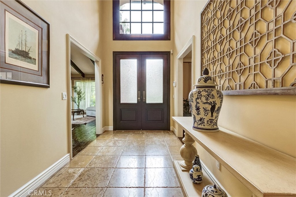 4751 Topeka Drive Tarzana, CA 91356 - Photo 6 of 65 a room with painting and a chandelier