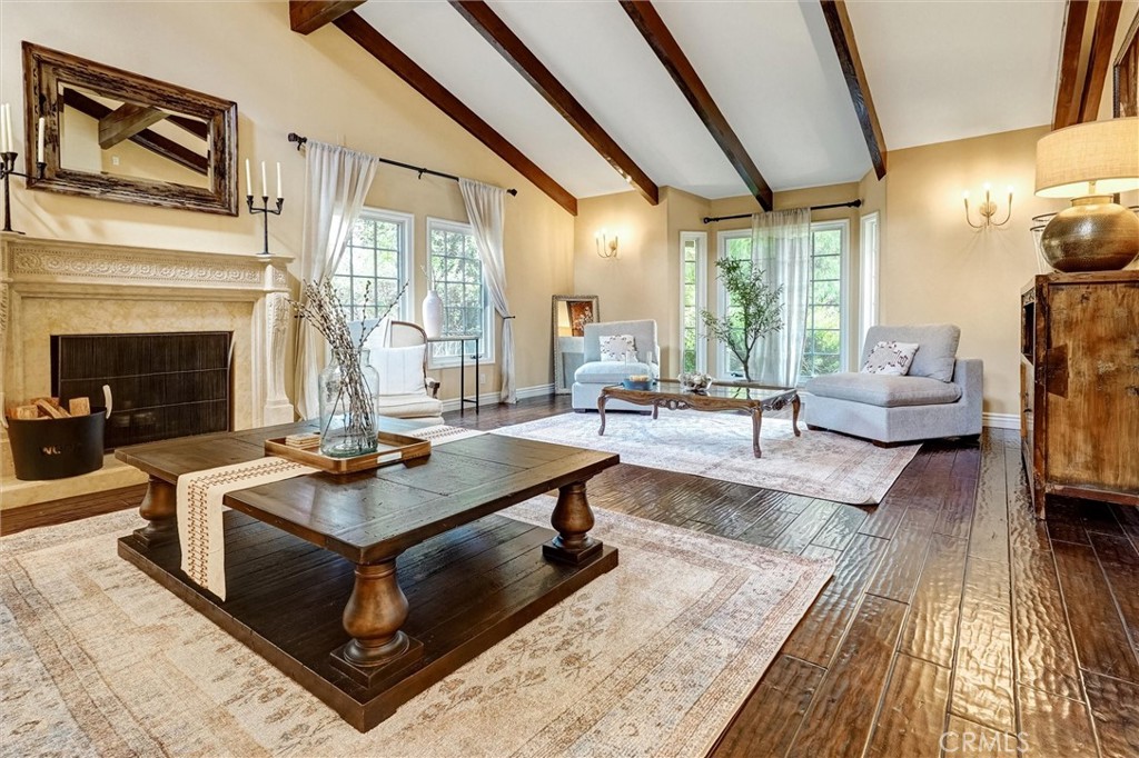 4751 Topeka Drive Tarzana, CA 91356 - Photo 7 of 65 a living room with fireplace furniture and a large window