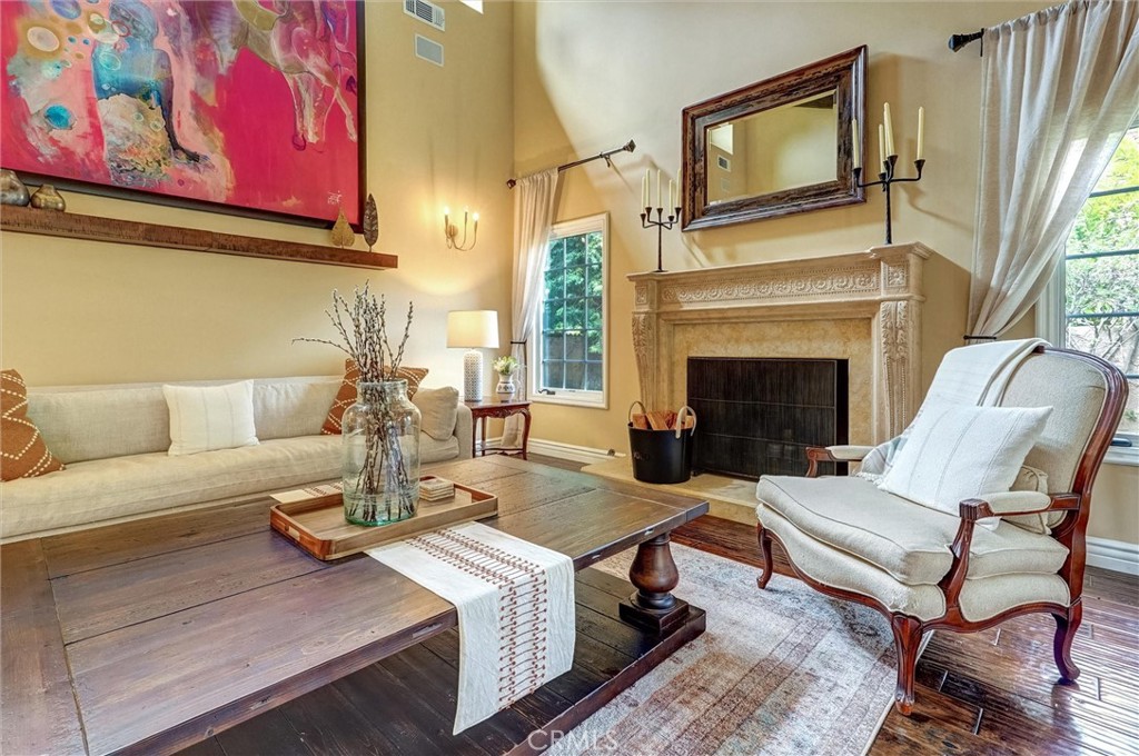 4751 Topeka Drive Tarzana, CA 91356 - Photo 9 of 65 a living room with furniture a fireplace and a large window