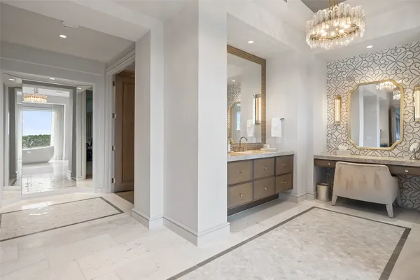 a bathroom with a double vanity sink and a mirror