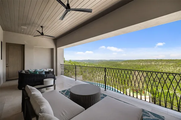 a swimming pool with outdoor seating and yard