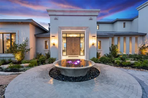 an outdoor space with furniture and fireplace