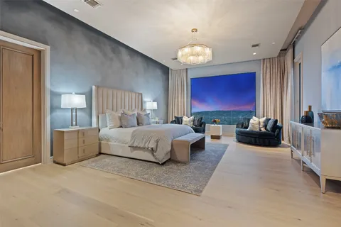 a living room with lots of furniture and a chandelier