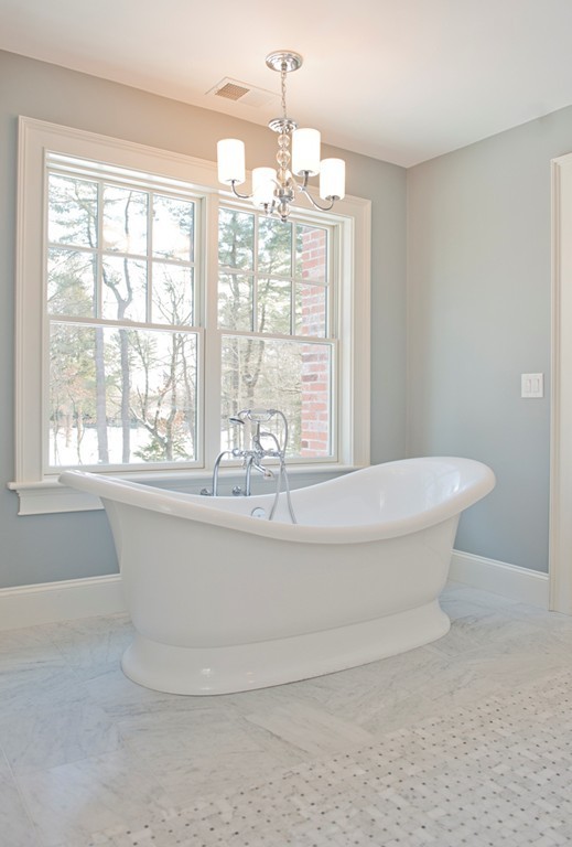 70 Loring Road Weston, MA 02493 - Photo 19 of 23 a spacious bathroom with a bathtub and chandelier
