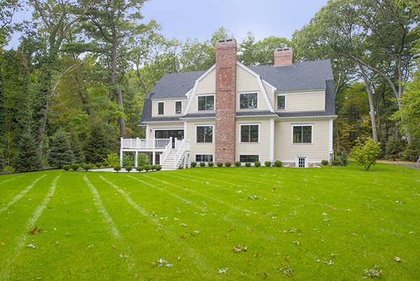 70 Loring Road Weston, MA 02493 - Photo 2 of 23 front view of a house with a yard