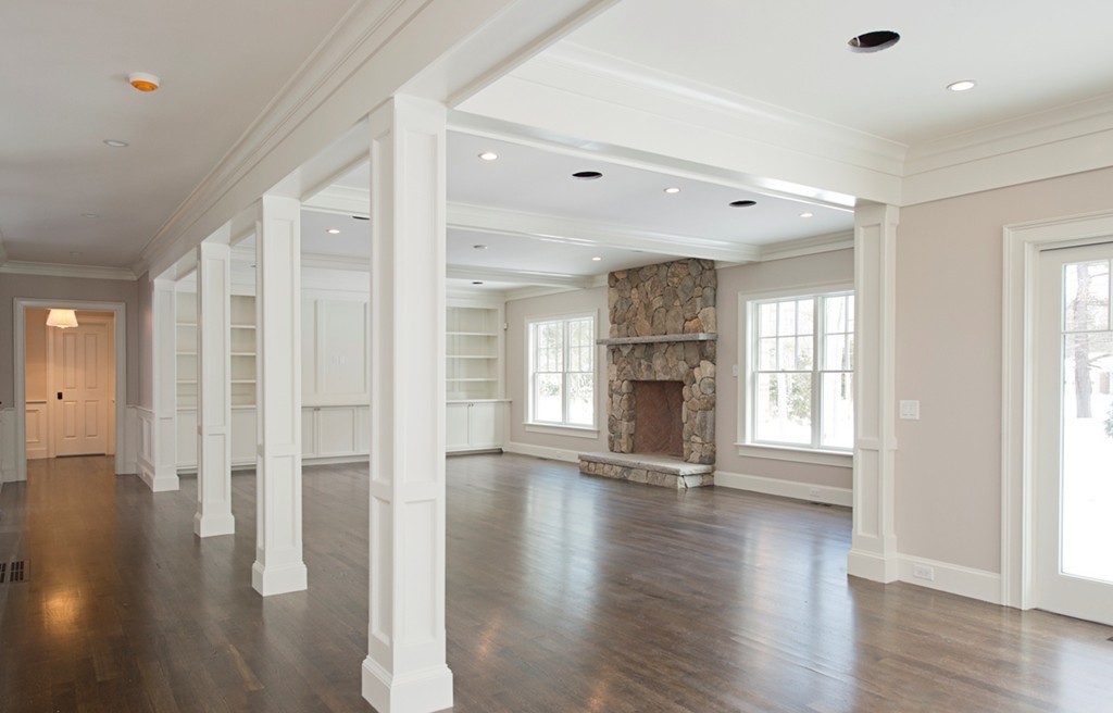 70 Loring Road Weston, MA 02493 - Photo 5 of 23 a view of an empty room with wooden floor and a window