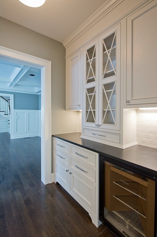 70 Loring Road Weston, MA 02493 - Photo 8 of 23 a kitchen with granite countertop white cabinets and window