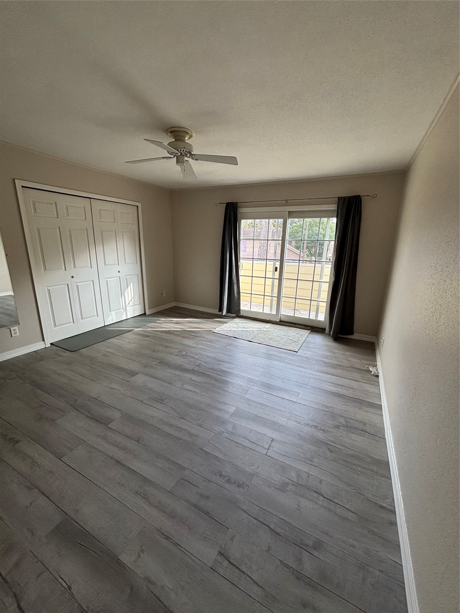 14515 Wunderlich Drive, Unit 315 Houston, TX 77069 - Photo 30 of 37 Spacious Closet, Ceiling Fan & Laminate Flooring