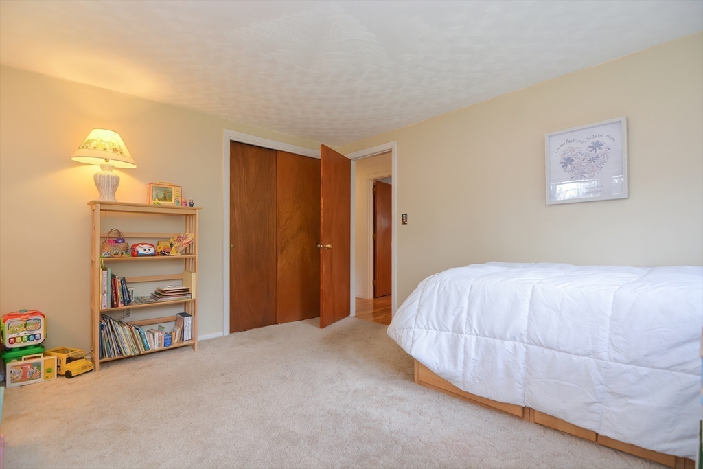 301 Taylor Road Stow, MA 01775 - Photo 18 of 35 a bedroom with a bed and a window