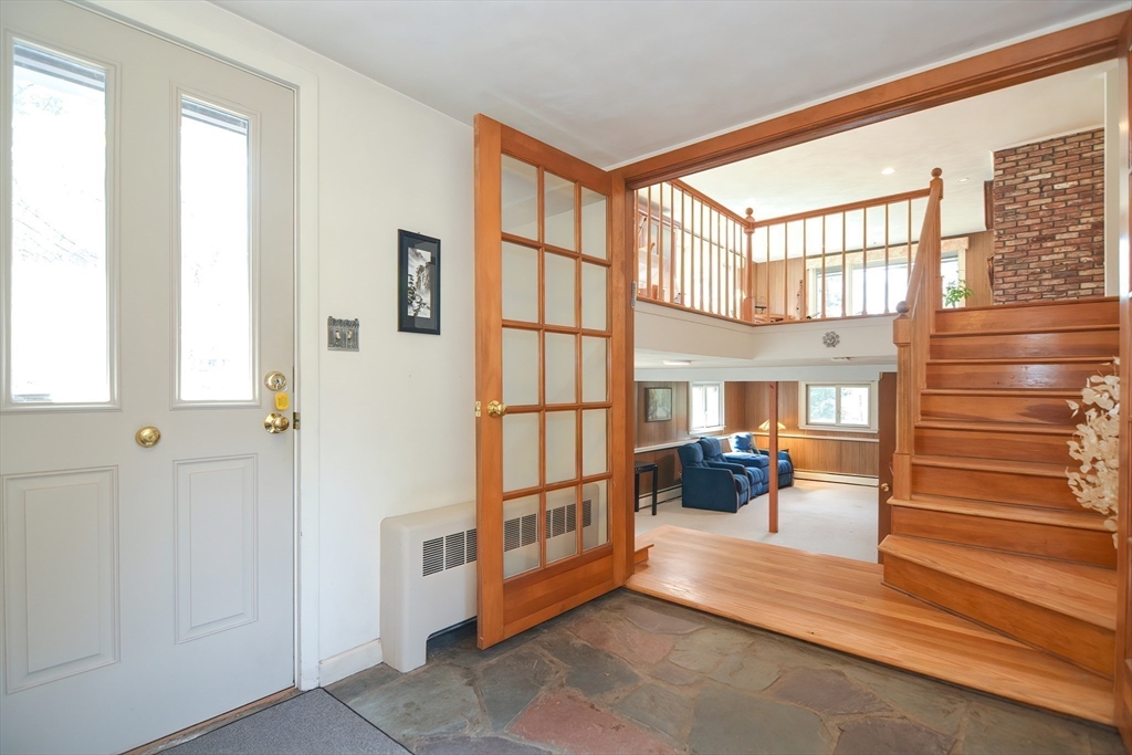 301 Taylor Road Stow, MA 01775 - Photo 5 of 35 a view of front door and bedroom with furniture
