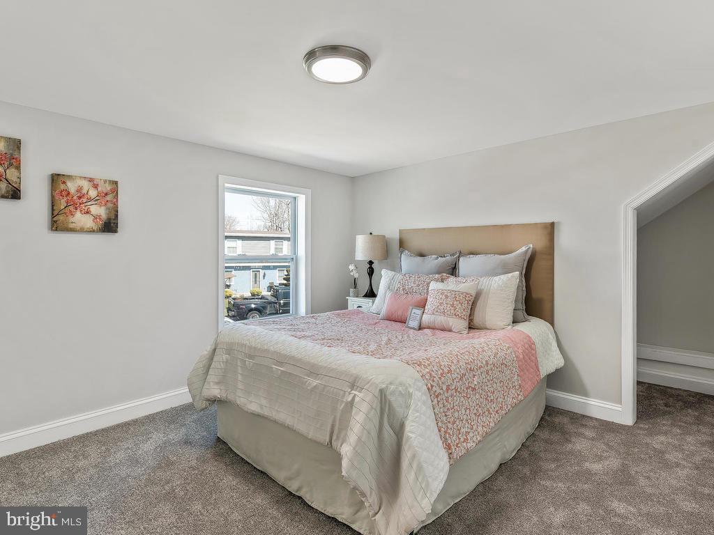 7718 Meath Road Dundalk, MD 21222 - Photo 21 of 27 a bedroom with a bed and window