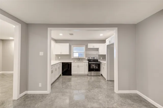 a view of a kitchen with a sink and an oven